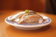 Raw Fish with Sushi Rice on a Plate