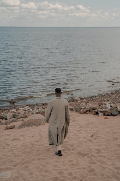 Man Walking Towards Sea 