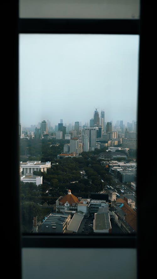 View of the Modern City from the Glass Window