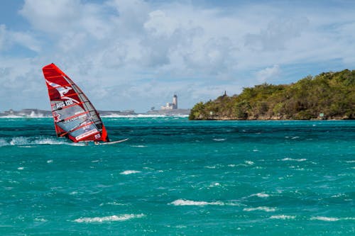 Photo of a Person Windsurfing on the Ocean