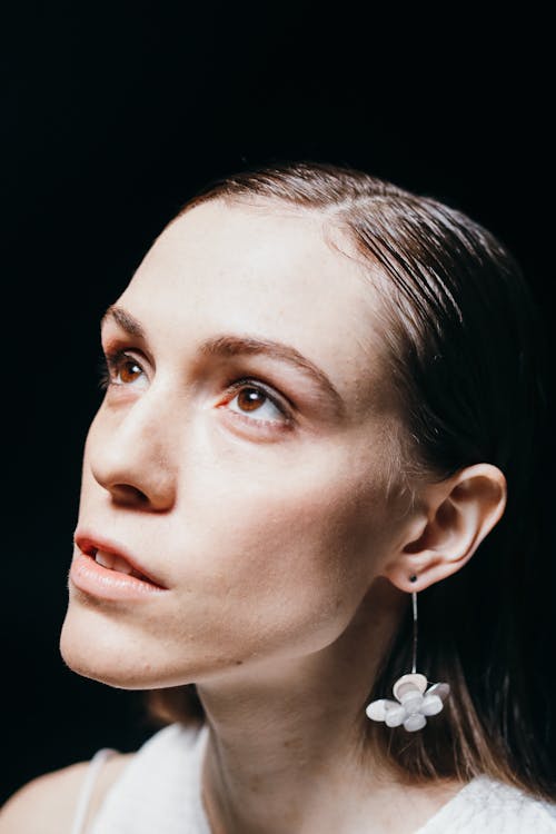 A Woman Wearing Earring Looking-Up