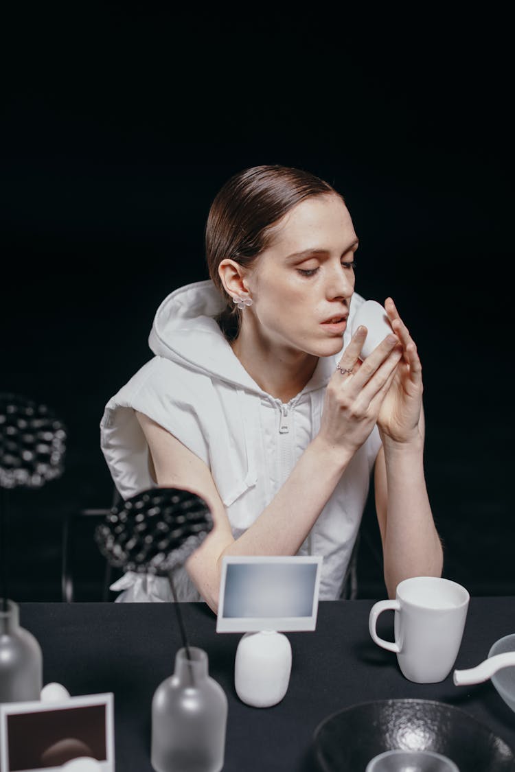 Woman Holding White Stone