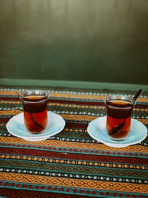 Clear Drinking Glass with Brown Liquid