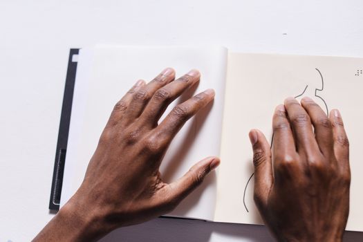 Persons Left Hand on White Laptop Computer