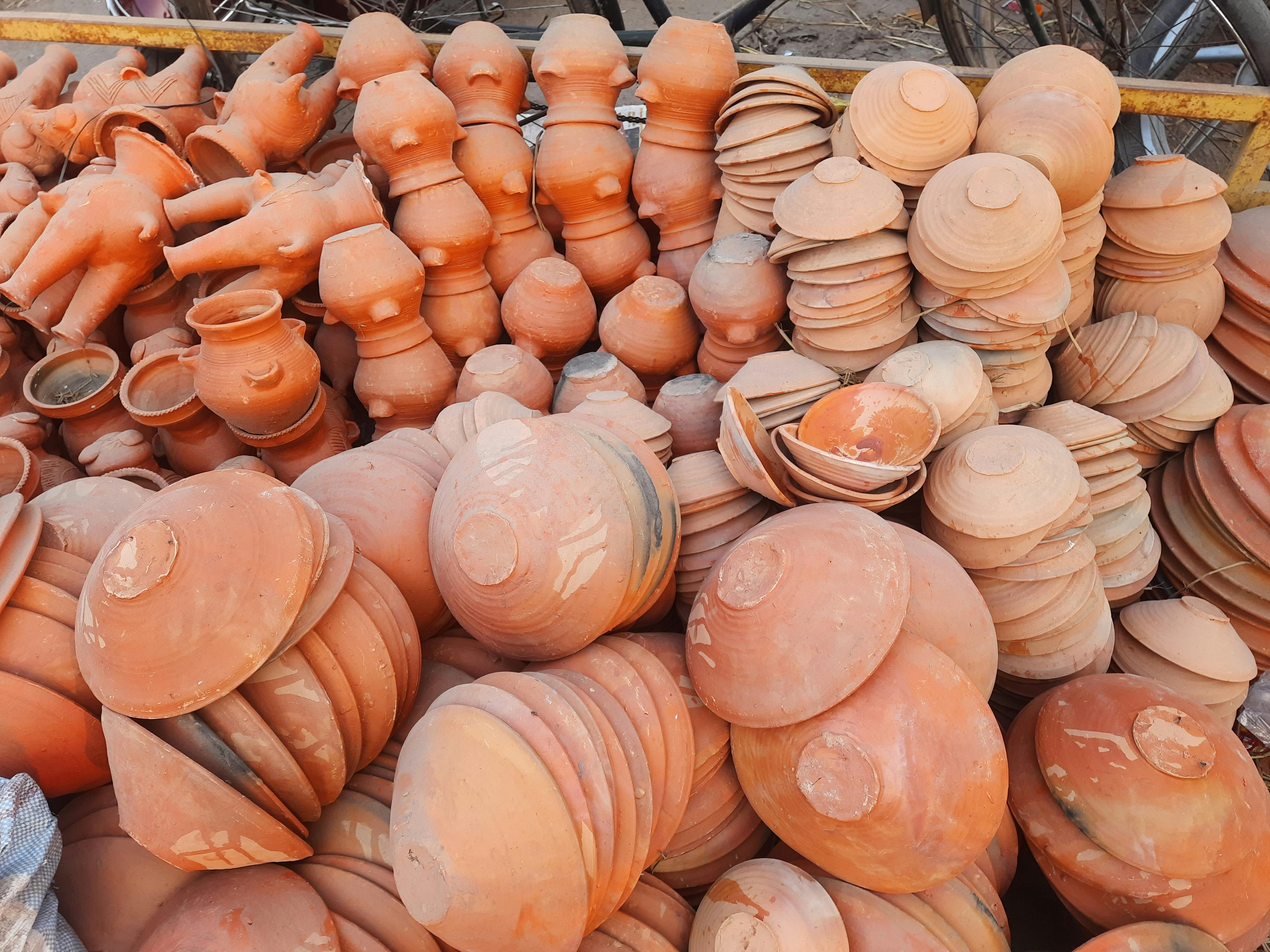 Person picking strawberries from a garden bed