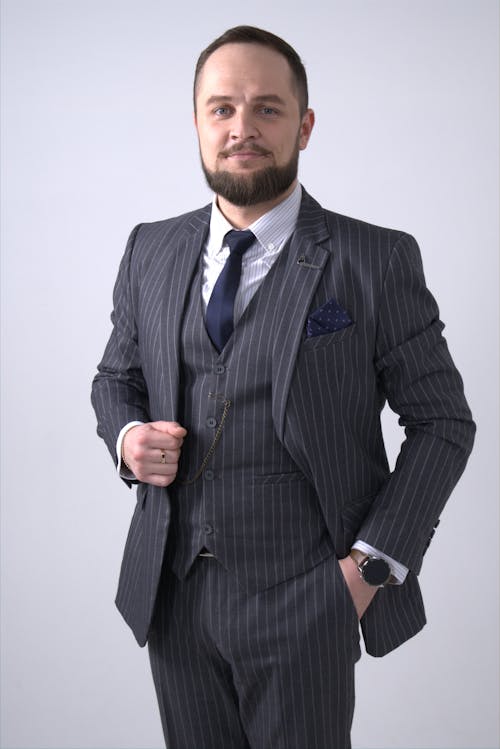 Confident Man in Black Pinstripe Suit Jacket