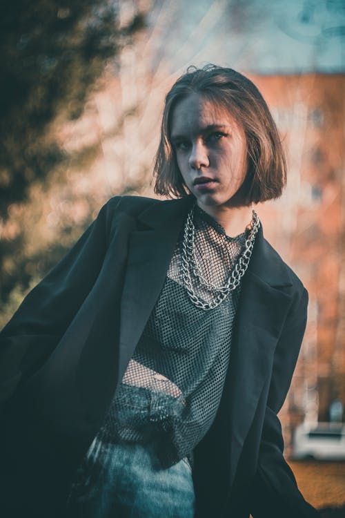 Portrait of a Teenage Girl Wearing Loose Jacket and Chain Necklace