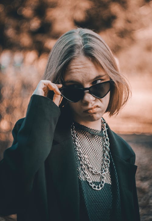 Woman in Black Blazer Wearing Black Sunglasses and Silver Necklace