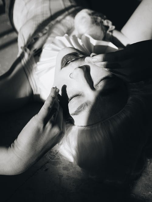 An Upside Down Shot a Female Wearing Historic Wig and Nose Piercing 