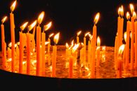 Lighted Candles on Snow Covered Ground