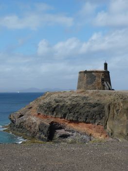 Explore the scenic Castillo on Lanzarote's coastline with ocean views.