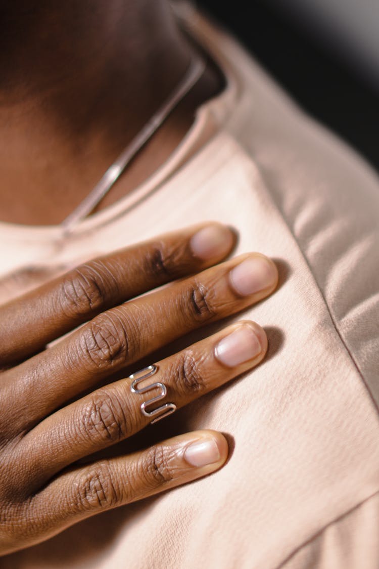 Close-up Shot Of A Hand On A Person's Shoulder