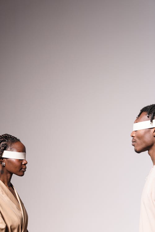 Blindfolded People Facing Each Other