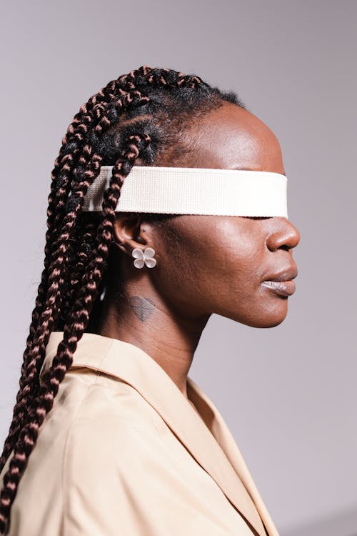 Woman Wearing Brown Coat Blindfolded 