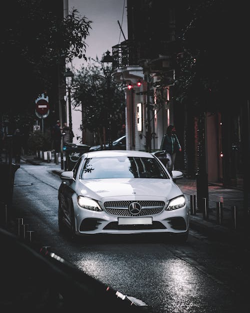 White Mercedes Benz Coupe on Road 