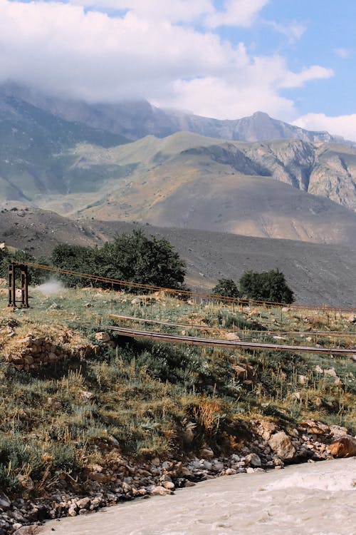 Green Grass Field Near Mountain