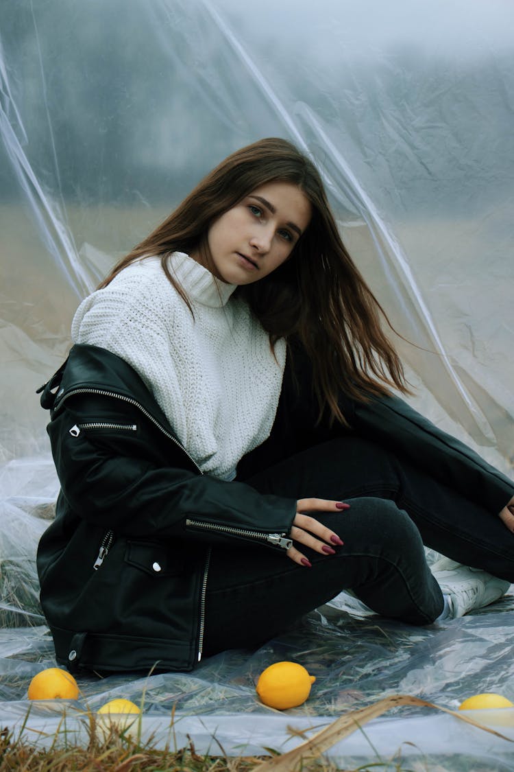 Woman Wearing White Sweater To Black Leather Jacket