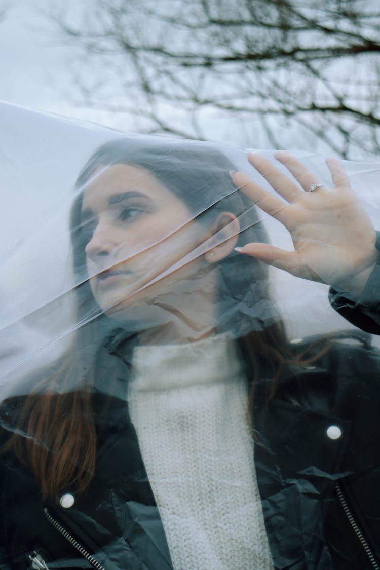 Young Woman In Plastic Foil Outdoors 