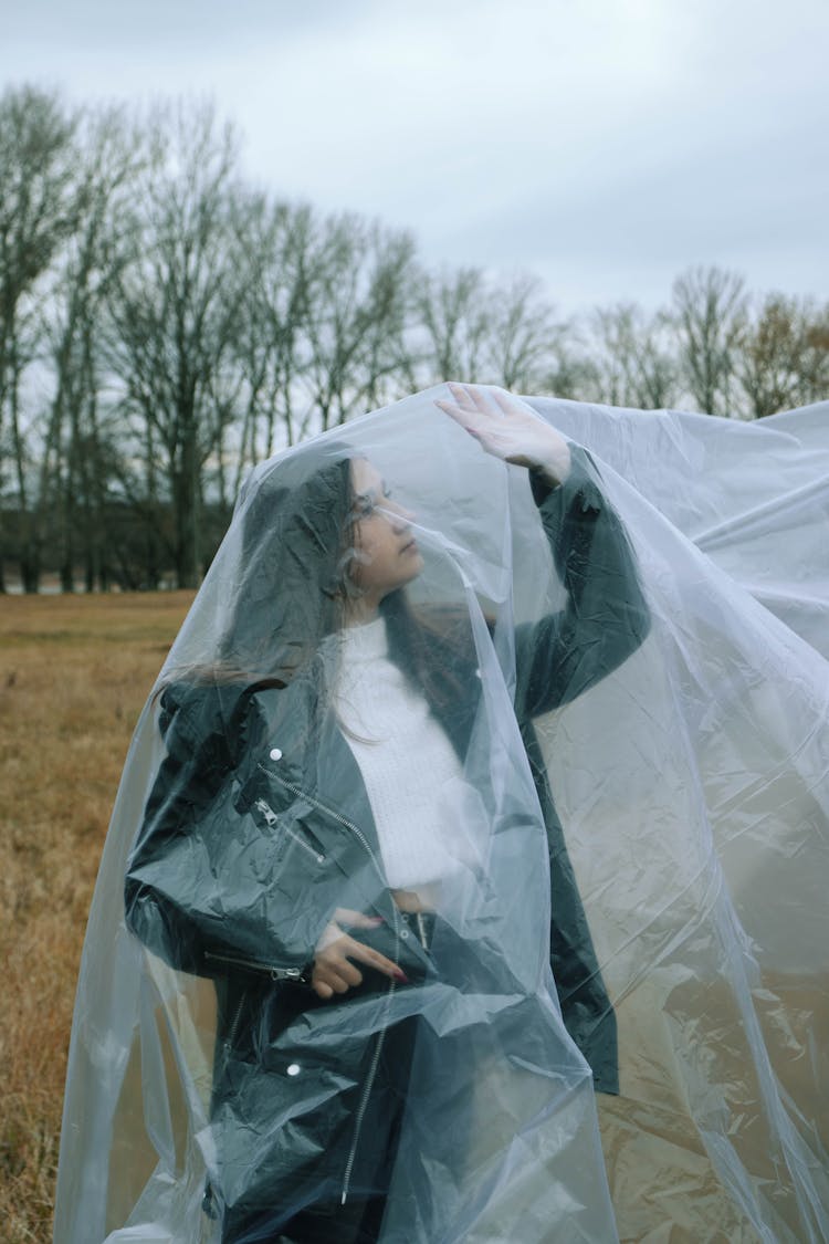 Woman Covered In Plastic Outdoors 