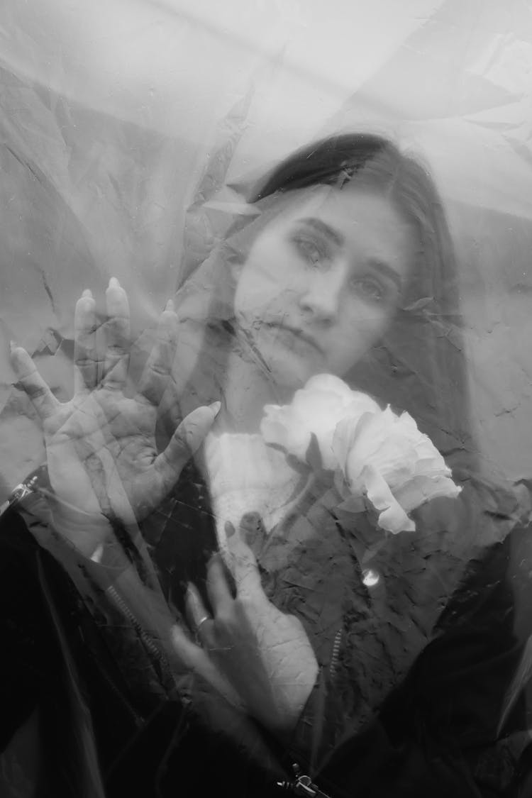 Girl Holding A Bouquet Behind A Screen