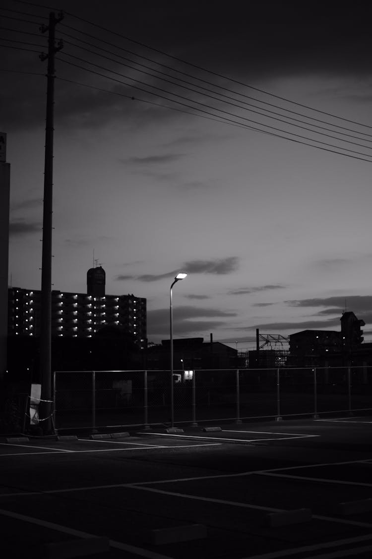 Empty Parking Lot In City At Night