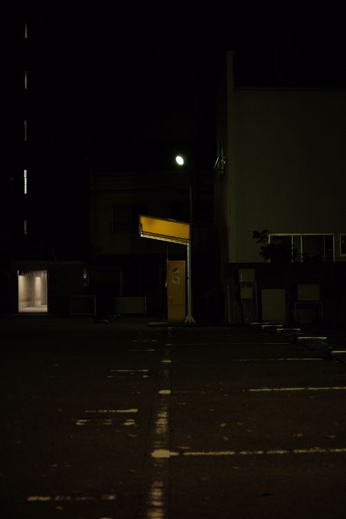 Free Atmospheric urban street at night with glowing lights and shadows. Stock Photo