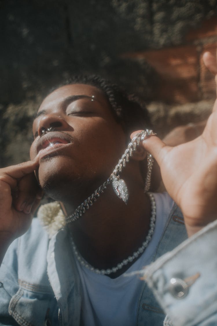 Young Man Wearing Chains And Necklaces 