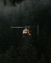 Helicopter Flying Over Forest