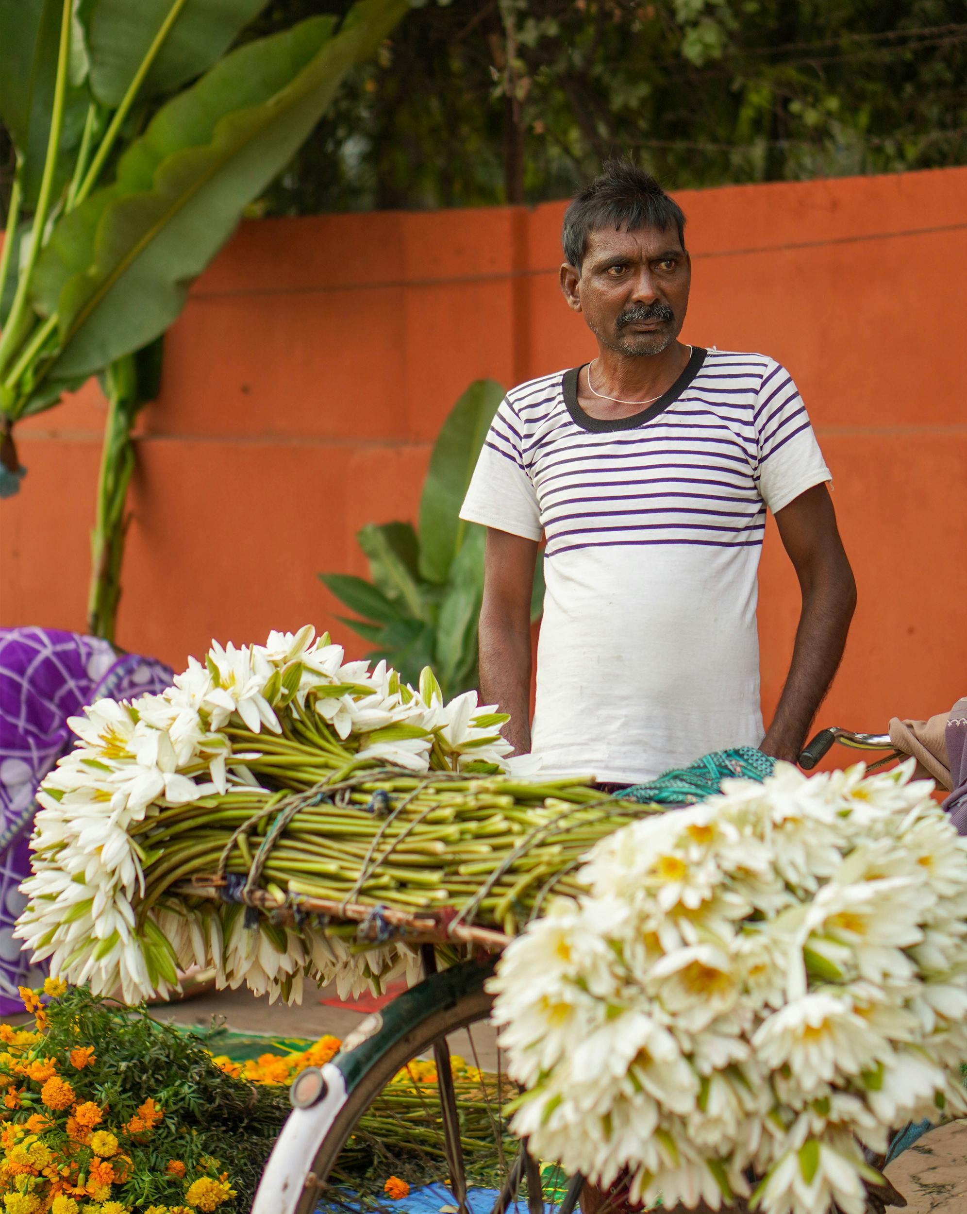 man selling flowers on the street