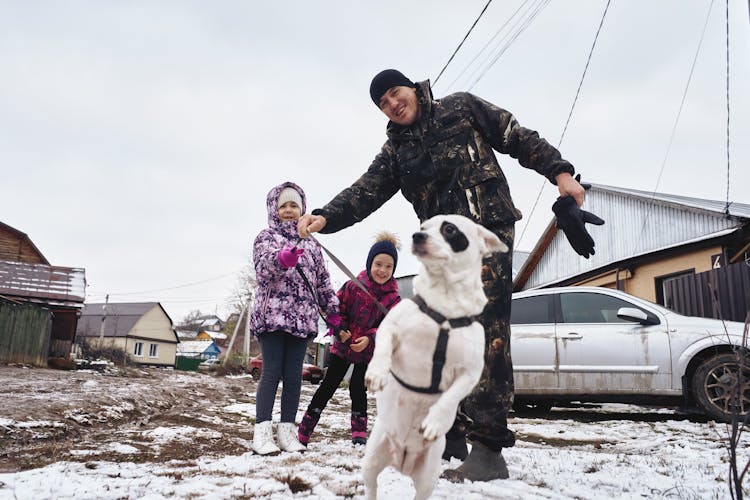 Family With Dog In Winter