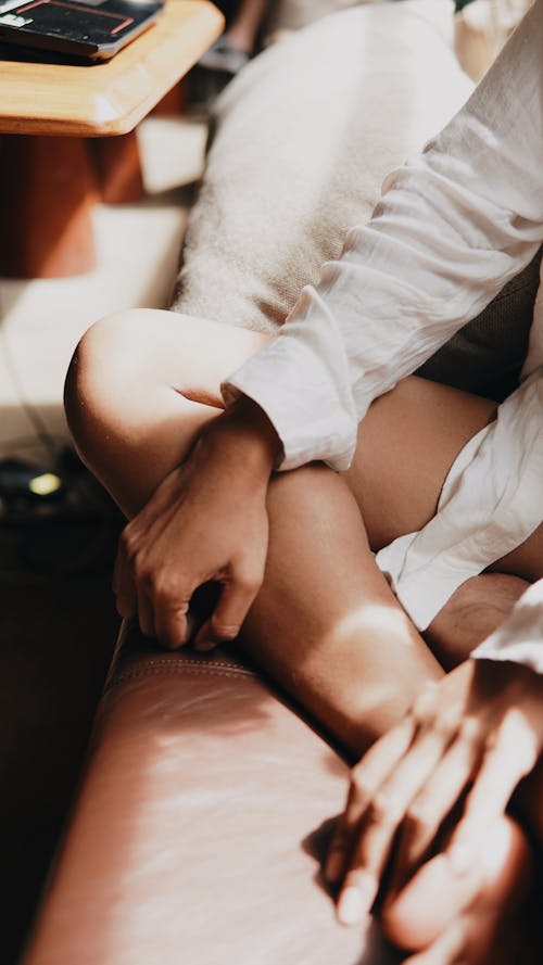 Woman Sitting on Sofa