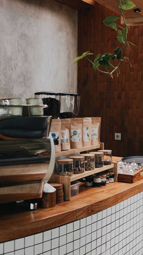 Coffee Beans Spice and Herbs in Glass and Paper Bags and Containers in Coffee Shop