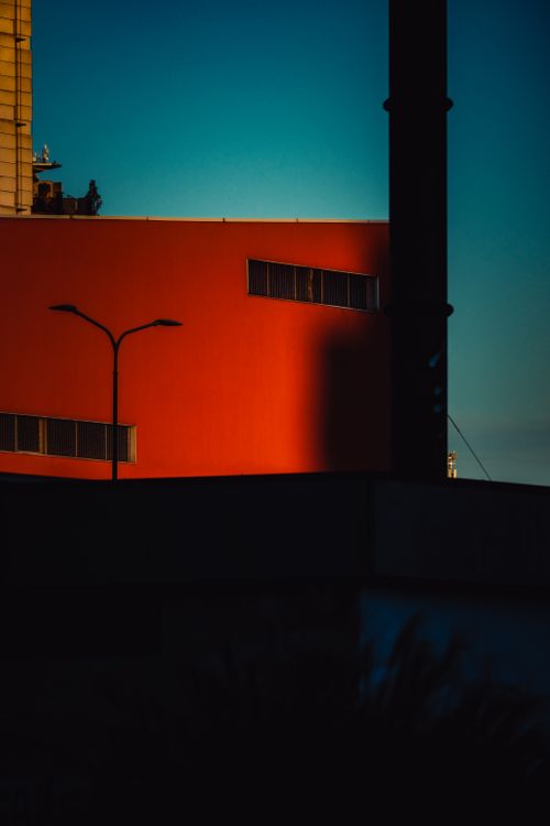Free Dramatic urban architecture in warm sunset light creating vibrant and modern feel. Stock Photo