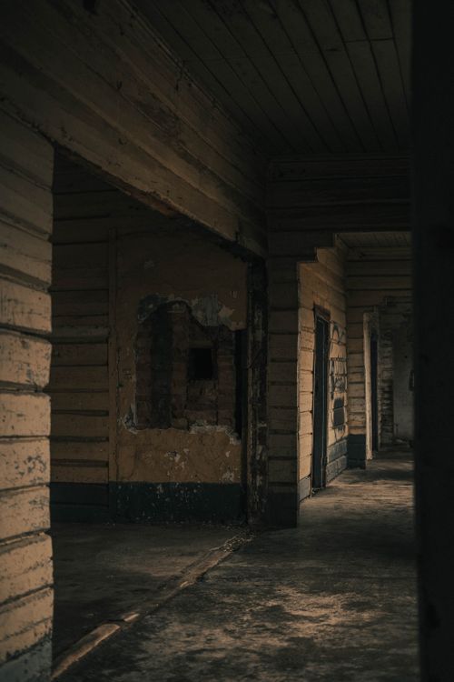 Free Dark corridor in a derelict building, capturing an eerie, abandoned atmosphere. Stock Photo