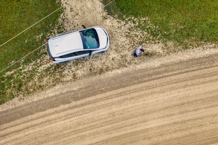 Top View Of A Car Parked On The Side Of A Road 