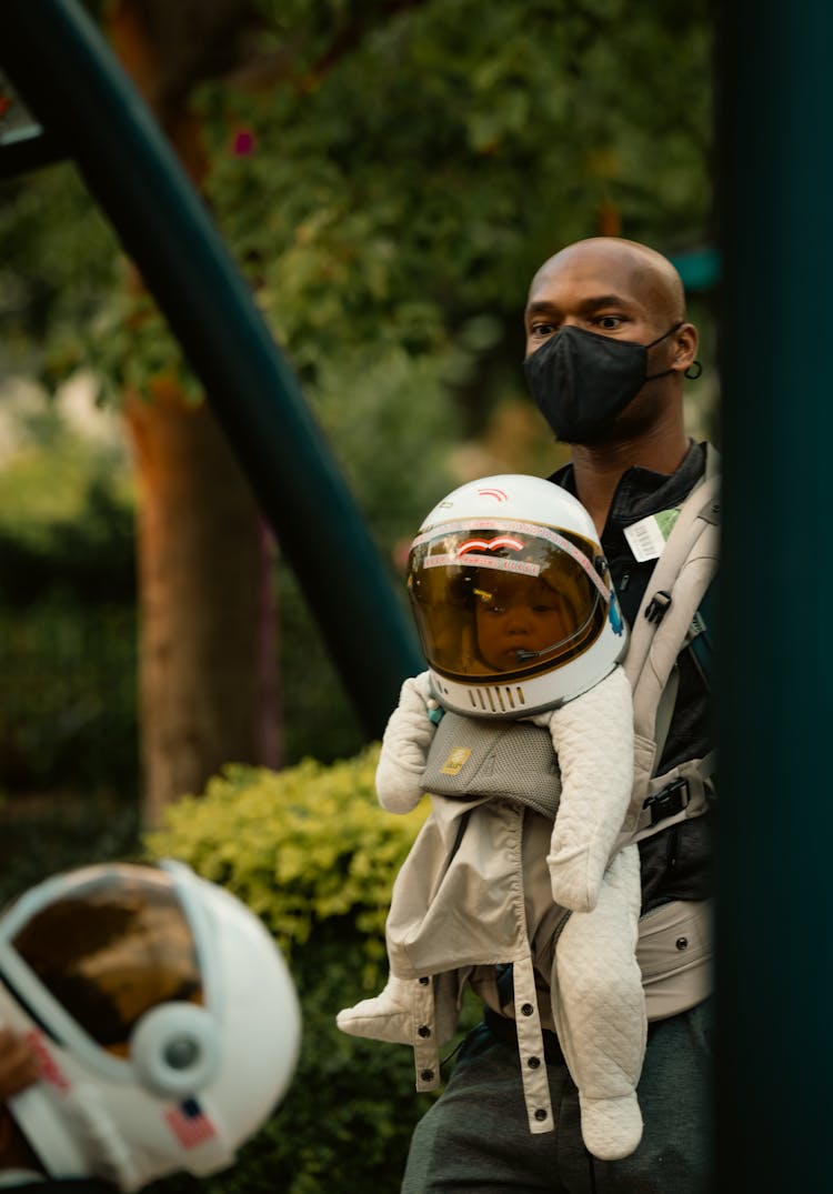 Father And Baby In A Little Astronaut Costume 