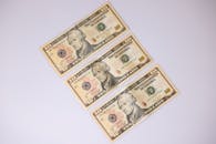 Close-Up Shot of Paper Money on White Surface