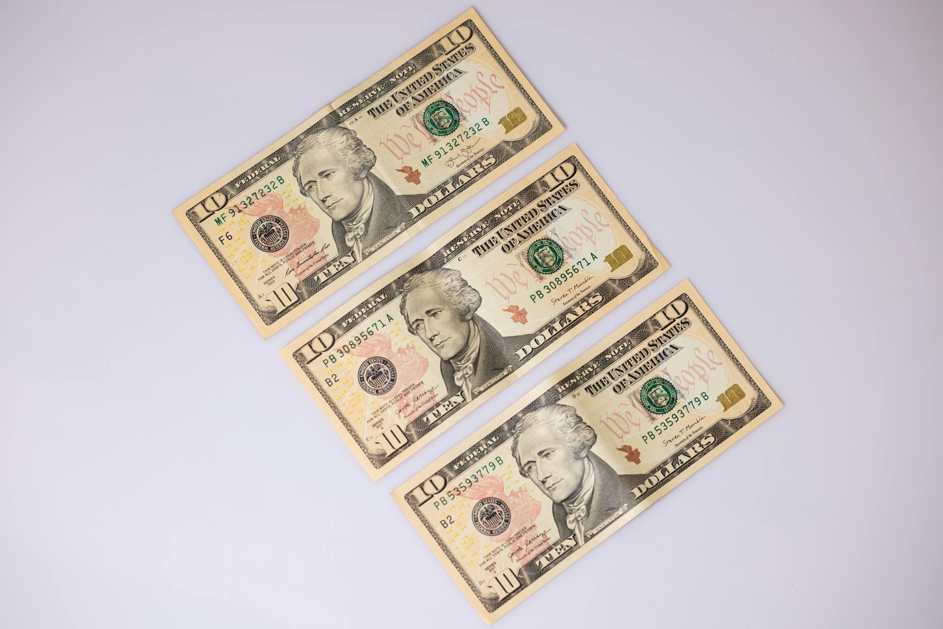 Close-Up Shot of Paper Money on White Surface