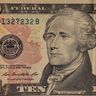 A detailed close-up of Alexander Hamilton on a United States ten-dollar bill.