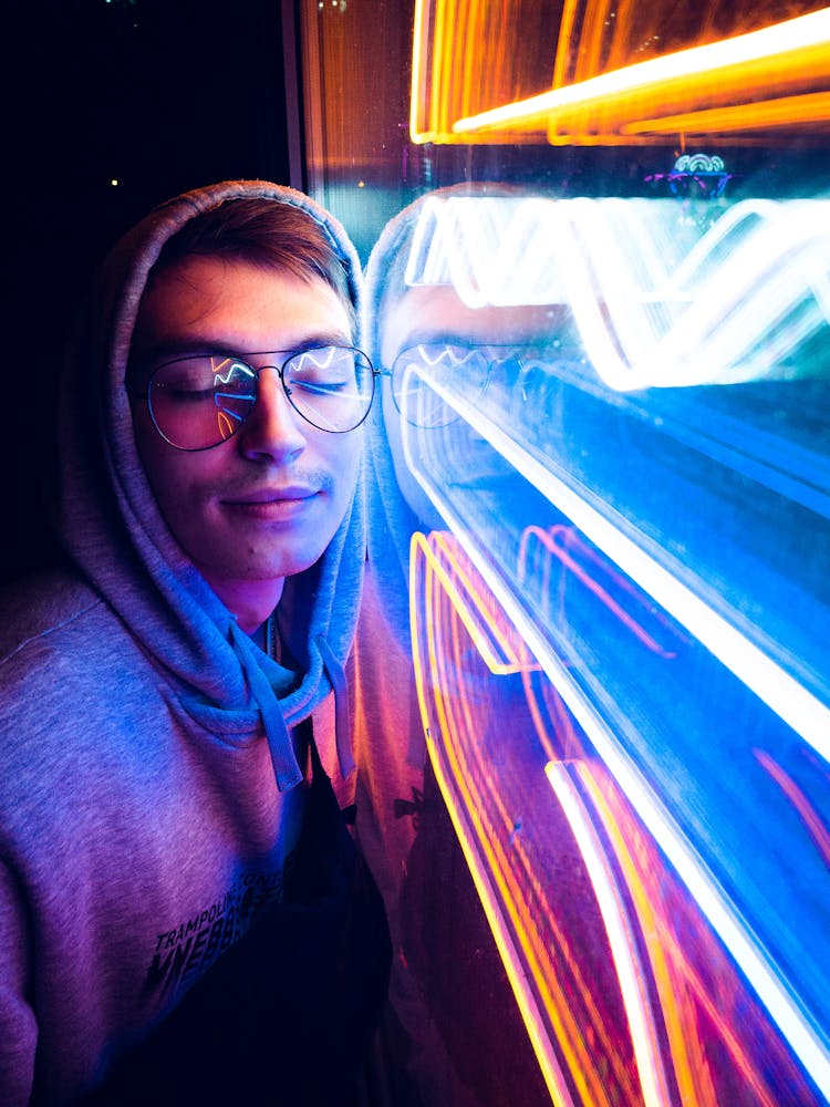 Young Man Posing By Neon