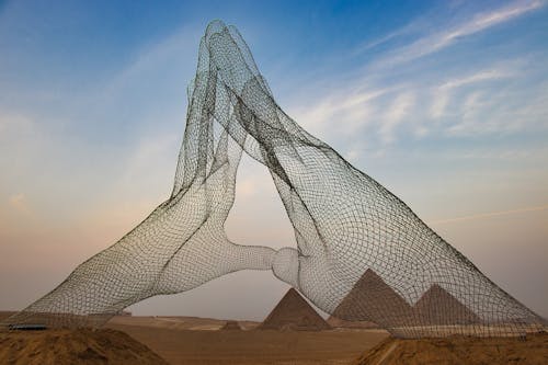 Hands Monument and Giza Pyramids