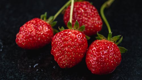 Free Fresh Strawberries on Black Surface Stock Photo