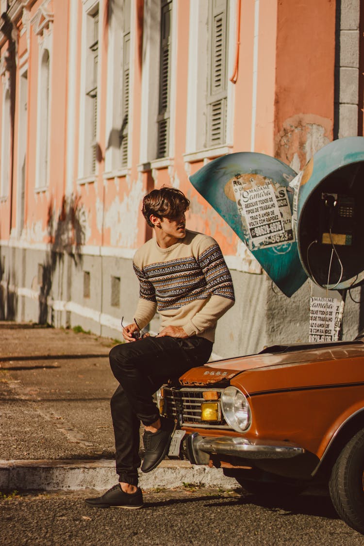 Male Driver Sitting On Old Car Mask And Waiting In Street