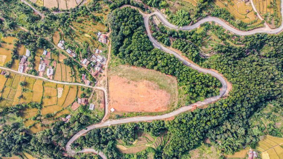 Spectacular Mount Everest Sightseeing Scenic Flight Tour - Plane/Helicopter Review 2026 - Aerial shot of Rampur countryside, showing fields and forests in Lumbini Province, Nepal.