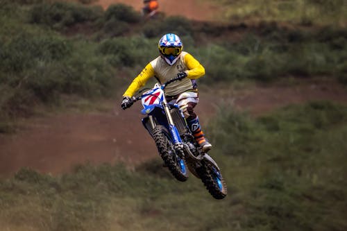 Free Man Riding Motocross Dirt Bike Stock Photo