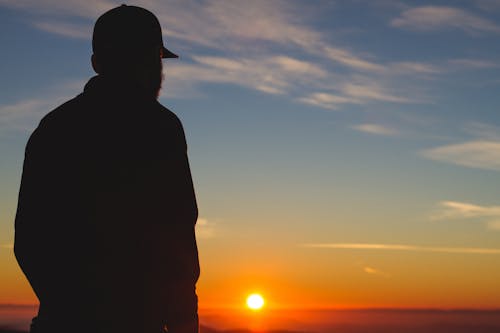 Silhouette of a Man With Sunset Fixture