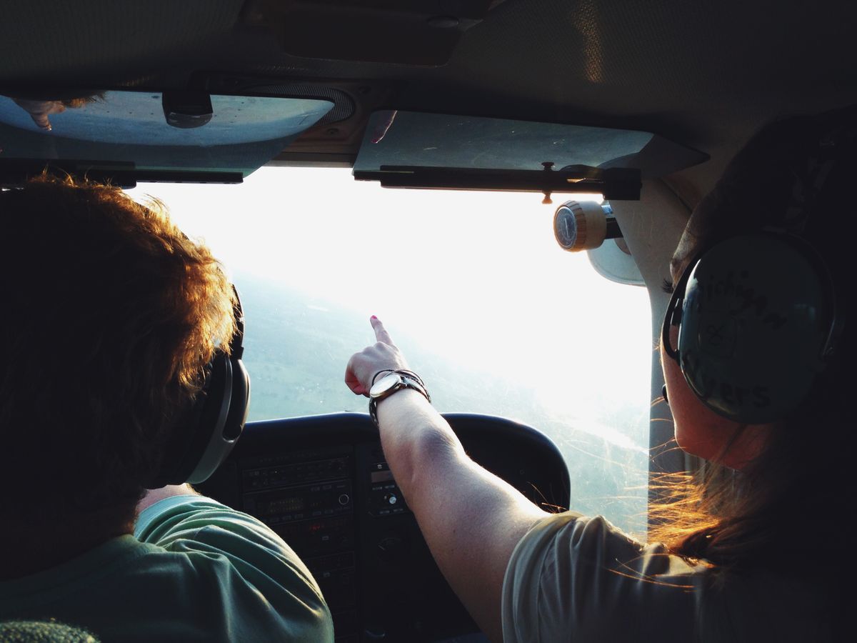 Two pilots in a cockpit working through pilot self-doubt together