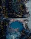 Aerial View of Dam Separating Forest and Lake