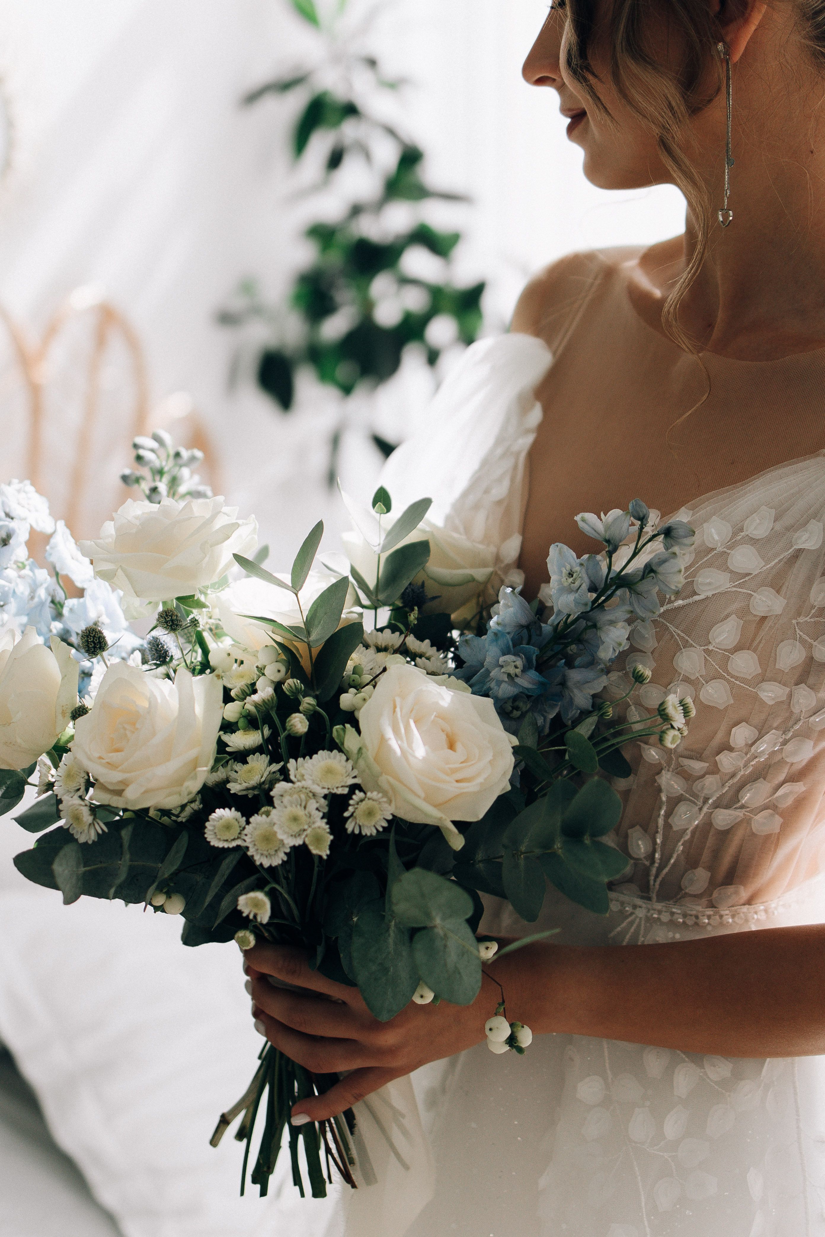 Woman Wearing White Gown Holding Bouquet of Flowers · Free Stock Photo