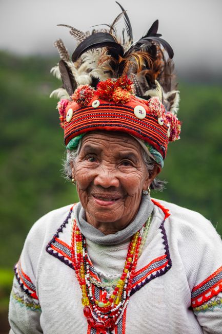 Elderly woman wearing traditional clothing and headwear in Banaue, Philippines
